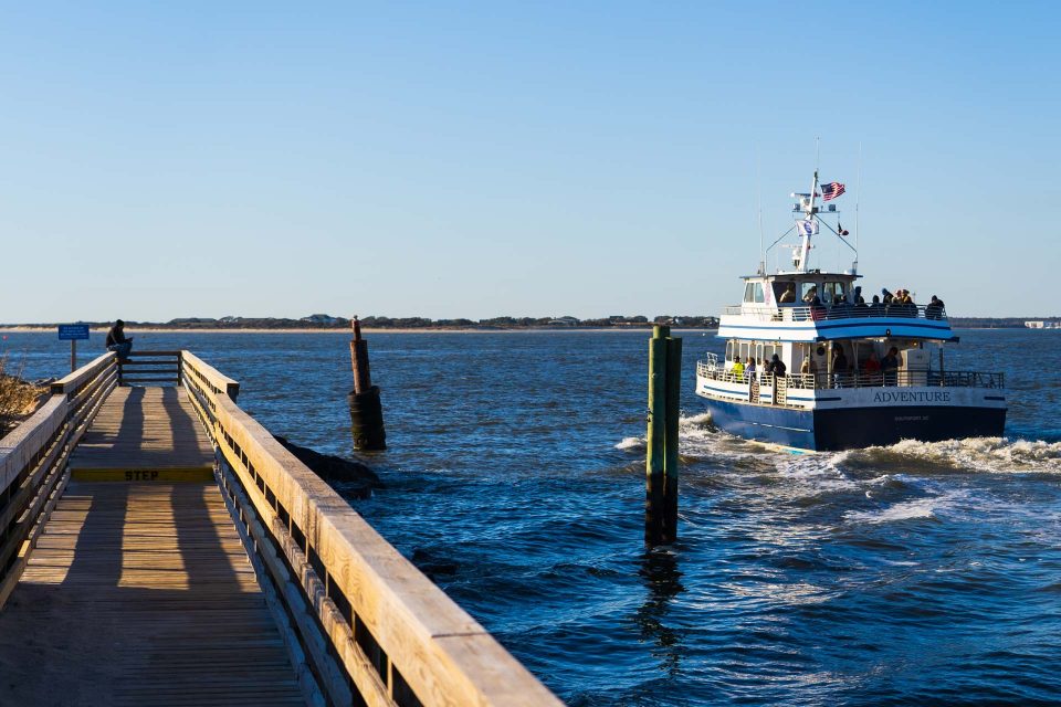 Ferry boat taking off from the coastline